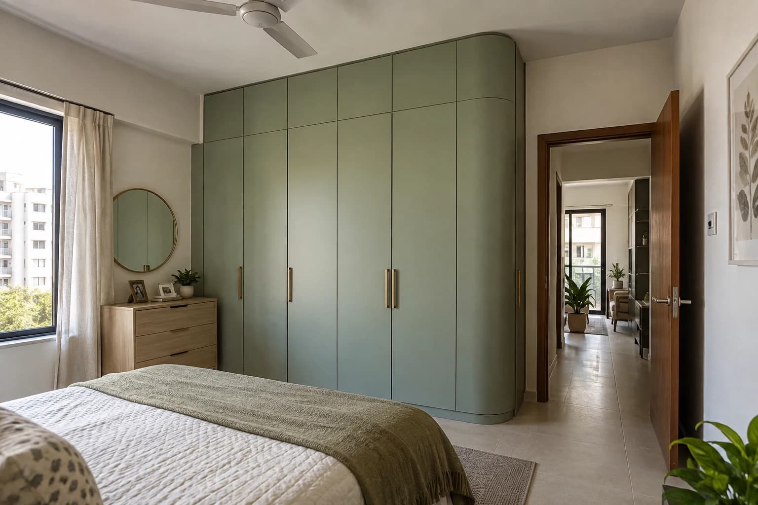Sage fitted wardrobe with a rounded exposed corner and conventional door panels