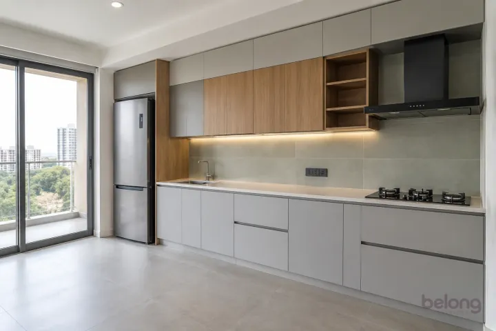 New modern compact straight kitchen in mist grey and light oak, with pale cream quartz worktops and large-format pale sage ceramic tiles.