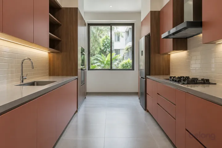 New modern parallel kitchen with a clear aisle in dusty coral and walnut, with warm grey quartz worktops and ivory horizontal stacked porcelain tiles.