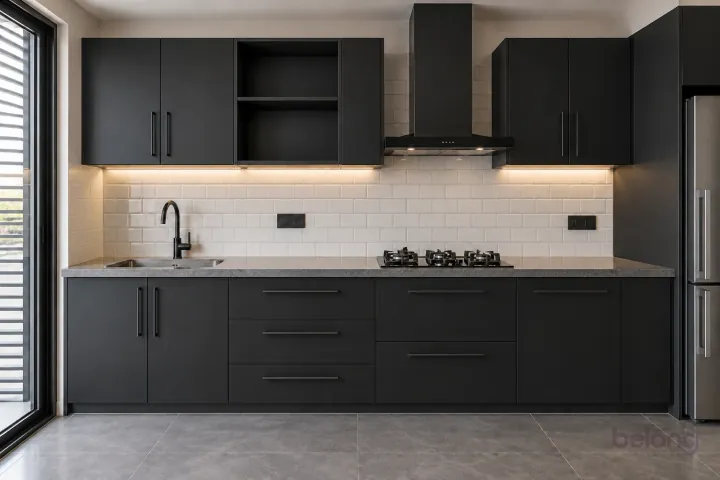 Black run with a white brick-look splash, with matte black and white brick tile finishes, precise fitted joinery and pristine surfaces in a contemporary Indian home.