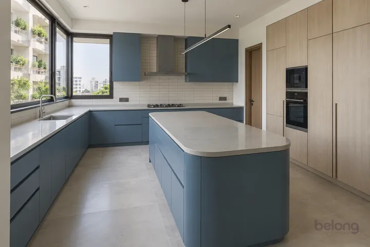 New modern villa kitchen with a central island in denim blue and pale ash, with pale grey quartz worktops and ivory narrow rectangular tiles in horizontal stack.