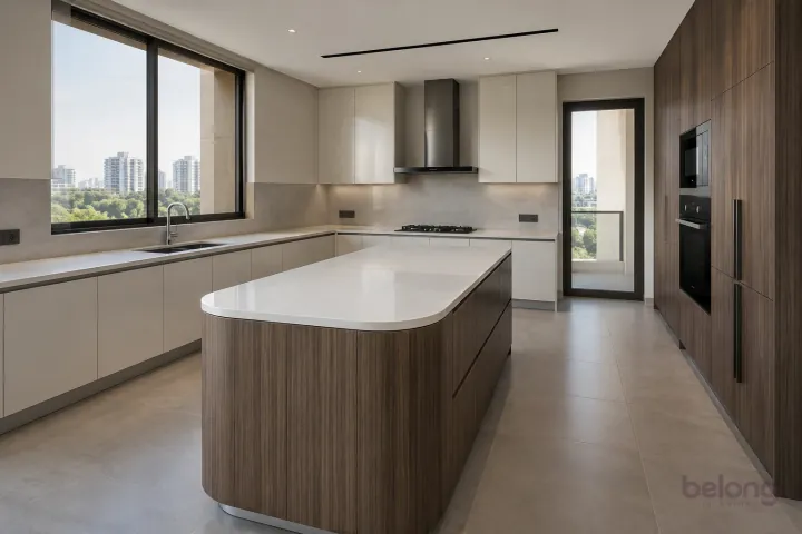 New modern villa kitchen with a central island in pearl white and smoked eucalyptus, with white quartz worktops and pale grey porcelain slab.