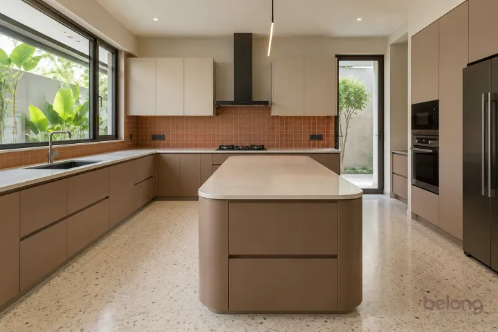 New modern villa kitchen with a central island in clay and sand, with ivory solid surface worktops and small satin terracotta square tiles.