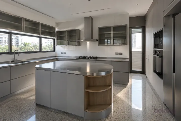 New modern island with open end storage in silver grey and stainless steel, with satin stainless steel worktops and large white porcelain tiles.