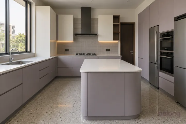 New modern villa kitchen with a central island in lilac grey and warm white, with plain white quartz worktops and soft grey satin square tiles.