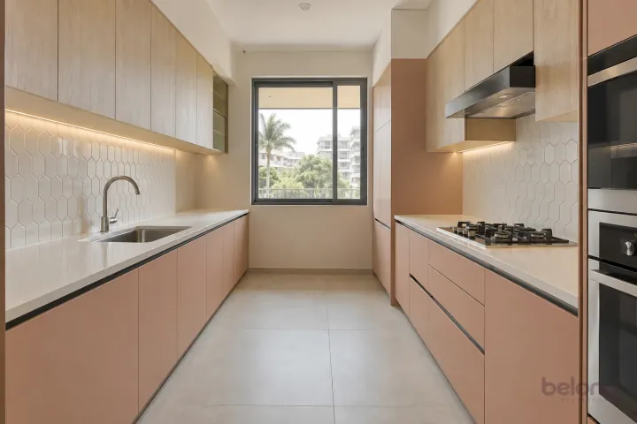 New modern parallel kitchen with a clear aisle in peach and bleached oak, with warm-white quartz worktops and ivory elongated hexagonal porcelain tiles.