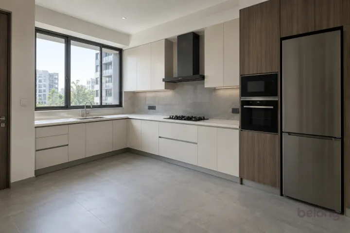 New modern compact L-shaped kitchen in pearl white and smoked eucalyptus, with white quartz worktops and pale grey porcelain slab.