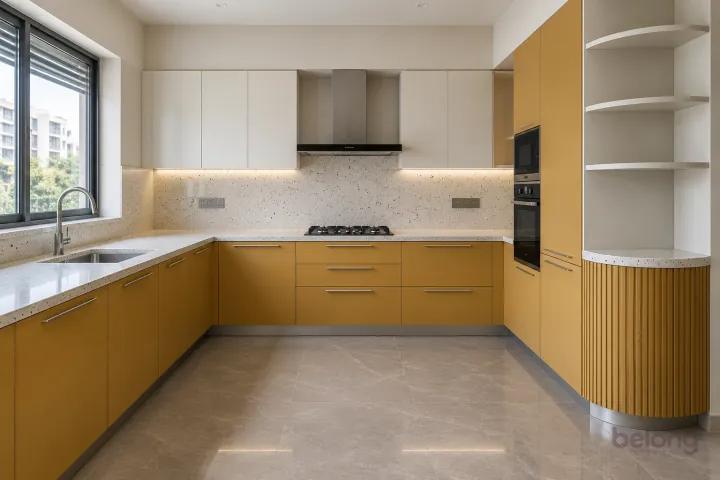 Mustard kitchen with a rounded cabinet end, with mustard and white quartz finishes, precise fitted joinery and pristine surfaces in a contemporary Indian home.