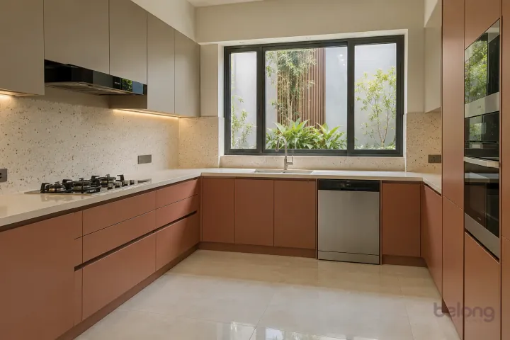 New modern white sink and brushed nickel tap in terracotta and warm taupe, with cream solid surface worktops and very pale beige fine-speckle terrazzo backsplash.