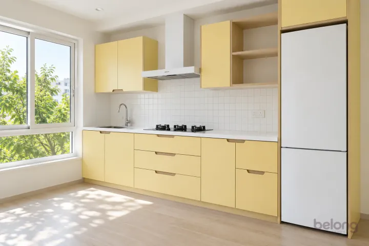 Butter yellow kitchen with birch ply edges, with butter yellow and clean white finishes, precise fitted joinery and pristine surfaces in a contemporary Indian home.